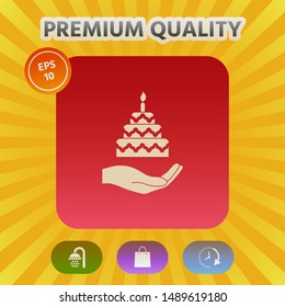 Hand holding a cake icon. Graphic elements for your design