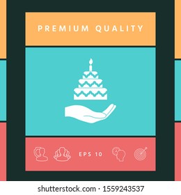 Hand holding a cake icon. Graphic elements for your design