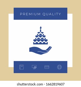 Hand holding a cake icon. Graphic elements for your design