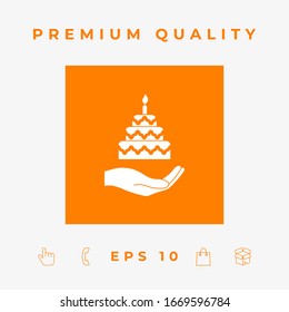 Hand holding a cake icon. Graphic elements for your design