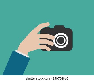 hand holding camera flat icon