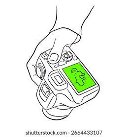 Hand holding camera with green screen