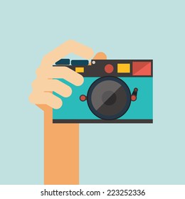 hand holding camera vector