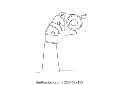 A hand holding the camera. World photography day one-line drawing