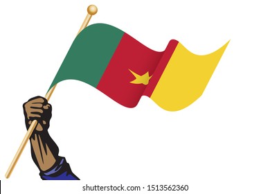 The hand holding the Cameroon flag.