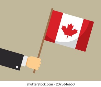 Hand holding Canadian flag. Vector illustration.