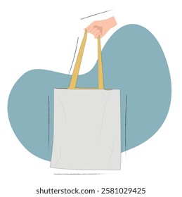 Hand holding a canvas tote bag