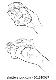 Hand holding car