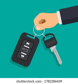 Hand holding car key and of the alarm system. Car rental or sale concept. Vector illustration in a flat trendy style.