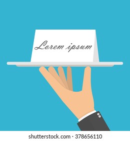 Hand holding or carrying paper card on a silver serving platter. Flat design