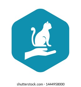 Hand holding a cat icon. Simple illustration of hand holding a cat vector icon for web
