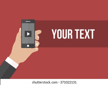 hand holding cellphone on dark red background