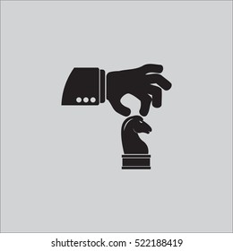 hand holding chess figure 