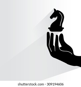 hand holding chess knight