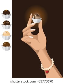 Hand holding chocolate truffle A woman's hand holds a chocolate truffle. Alternate truffles are also included. Grouped and layered vector file is easy to edit.