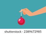 
Hand Holding a Christmas Ball Vector Banner Design. Unrecognizable person offering a Christmas ornament as a gift 
