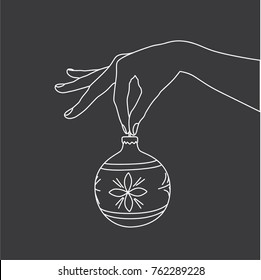 Hand holding a christmas ball, vector illustration design. Hands collection.