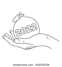 Hand holding a Christmas decoration ball with 2022 pattern. Hand drawn vector illustration in line art style, isolated on a white background.