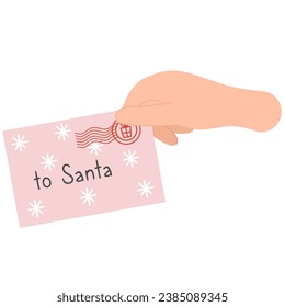 Hand holding a Christmas letter.  Letter to Santa Claus	