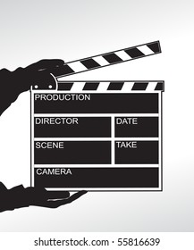 Hand holding a clapper board