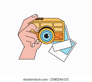 Hand holding a classic yellow camera with printed photos cartoon illustration vector hand drawn retro