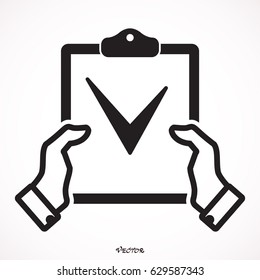 Hand holding clipboard checklist