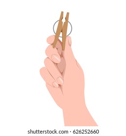 Hand holding a clothespin.