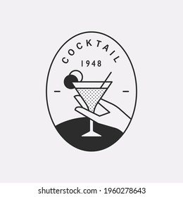 A hand holding a cocktail glass. Black color hipster design illustration logo.