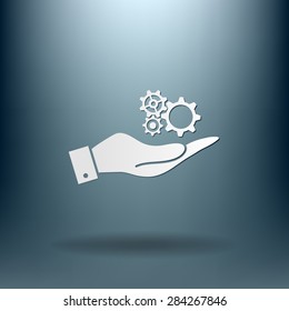 hand holding a cogwheel, icon setting and repair