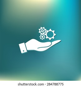 hand holding a cogwheel, icon setting and repair