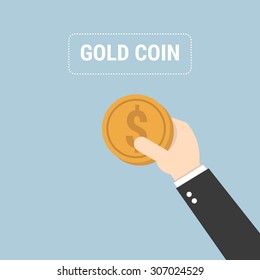 Hand holding a coin