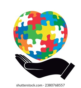 Hand holding a colorful puzzle heart. Vector isolated on white background.