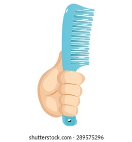 Hand holding a comb