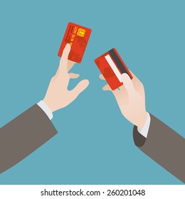 Hand holding the credit card against the blue background