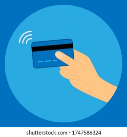 Hand holding a credit card with contactless wireless pay sign