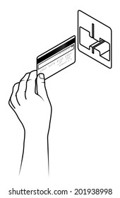 Hand holding a credit card inserting it into a card reading slot.
