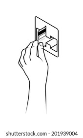 Hand holding a credit card inserting it into a card reading slot.