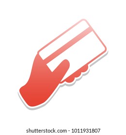 Hand holding a credit card. Vector. Reddish icon with white and gray shadow on white background. Isolated.