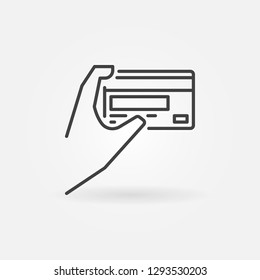 Hand holding a credit card vector outline icon. Card payment concept symbol in thin line style