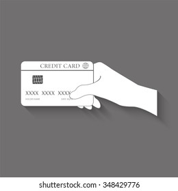 hand holding credit card vector icon with shadow