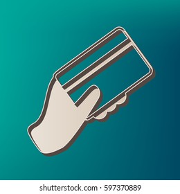 Hand holding a credit card. Vector. Icon printed at 3d on sea color background.
