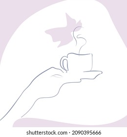 hand holding a cup of coffee