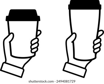 Hand holding a cup of coffee