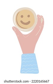 Hand holding cup of coffee with smiling face inside. Top view. Coffee lover, coffee break concept. Hand drawn vector illustration