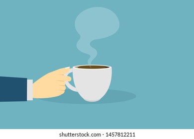 Hand holding a cup of hot coffee