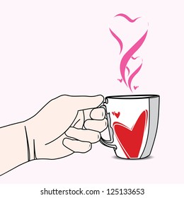 Hand holding a cup of love with heart shaped smoke.