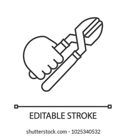Hand holding cutting pliers linear icon. Thin line illustration. Carpenter, repairman. Contour symbol. Vector isolated outline drawing. Editable stroke