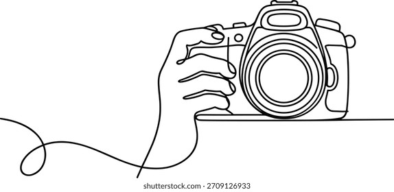 Mano que sostiene el dibujo continuo de la línea de la cámara de D S L R