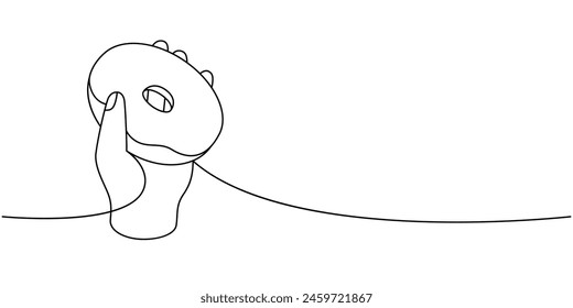 Hand holding delicious doughnut one line continuous drawing. Bakery sweet pastry food. Vector linear illustration.