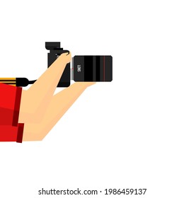 Hand holding a digital camera on white background.